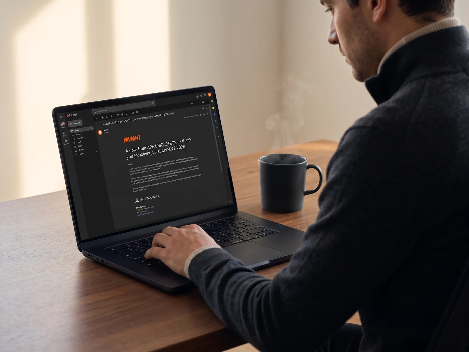 A MacBook Pro showing Gmail dark mode with a post-event email from the sponsor at MVMNT 2026.